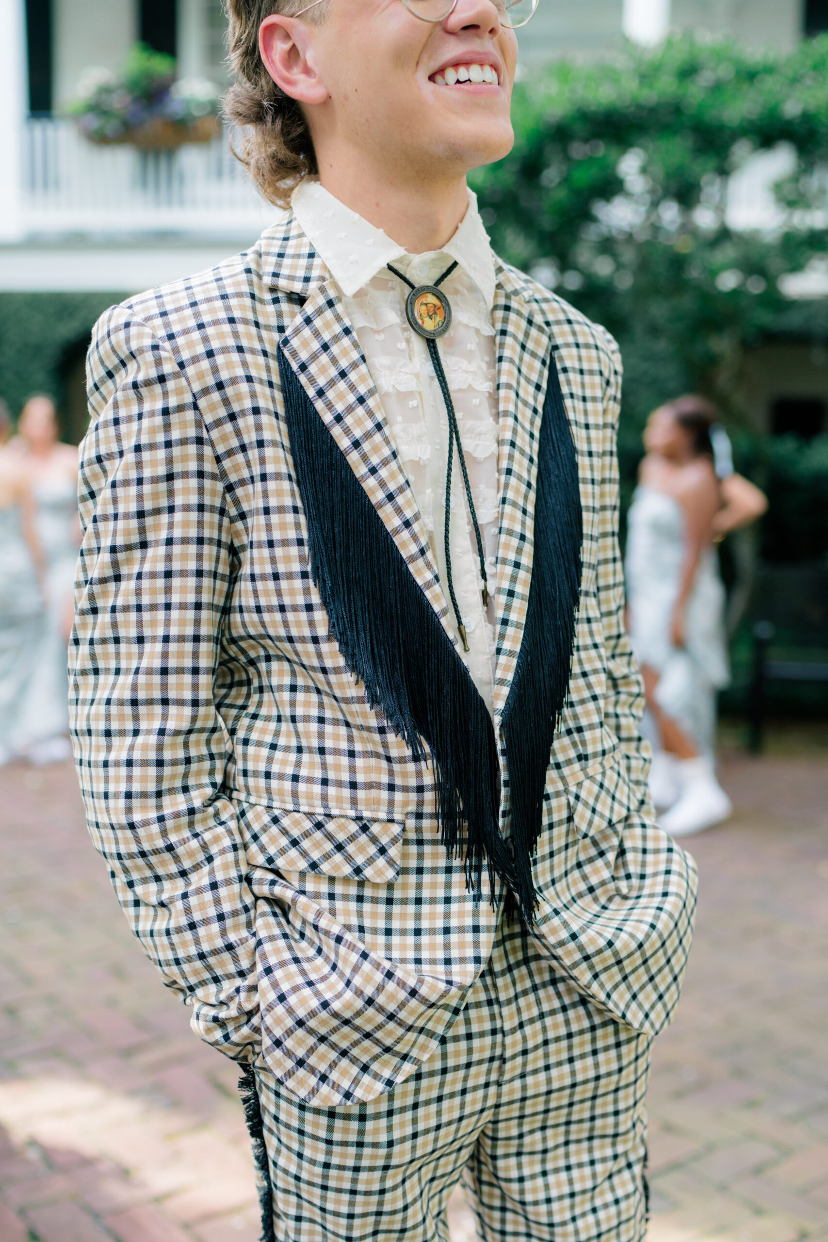 Groom's second outfit featured a billowing blouse complemented with a bolo tie. 