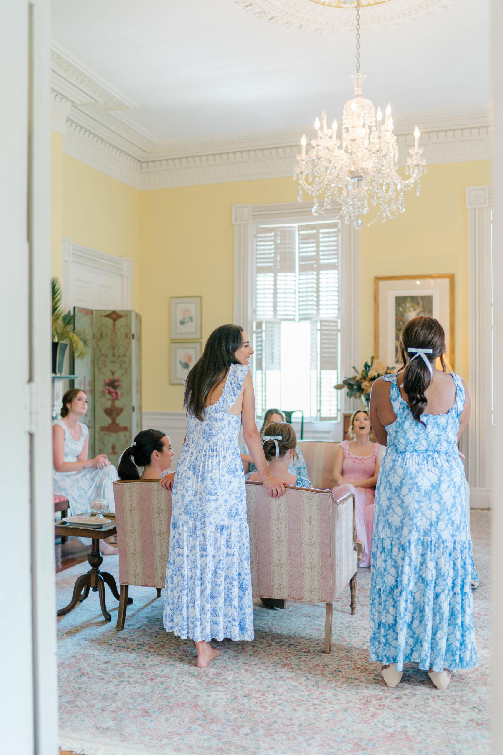 Cute mismatched floral bridesmaids getting ready long dresses. Charleston spring wedding.