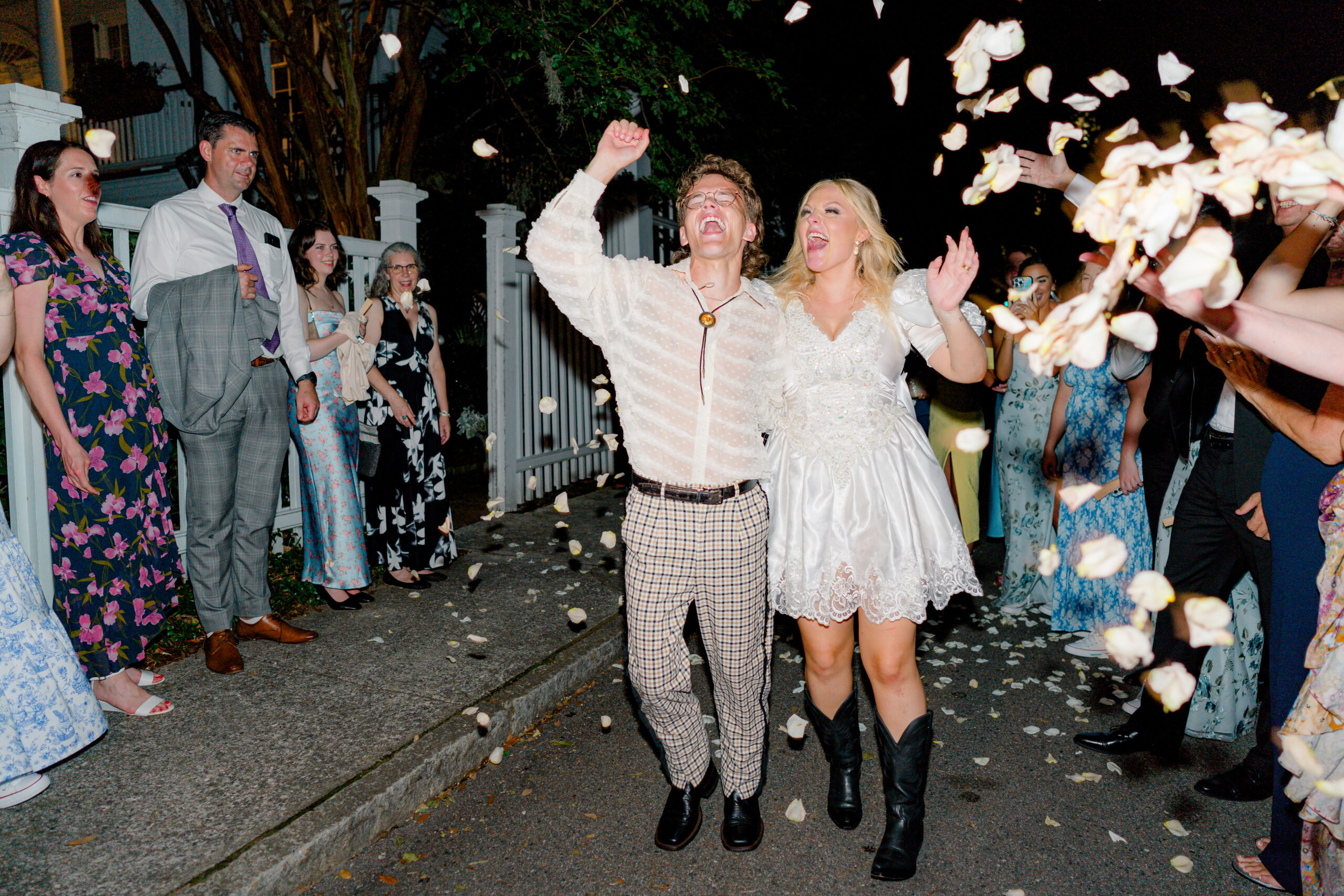 Bride and groom wedding exit with petal toss. 