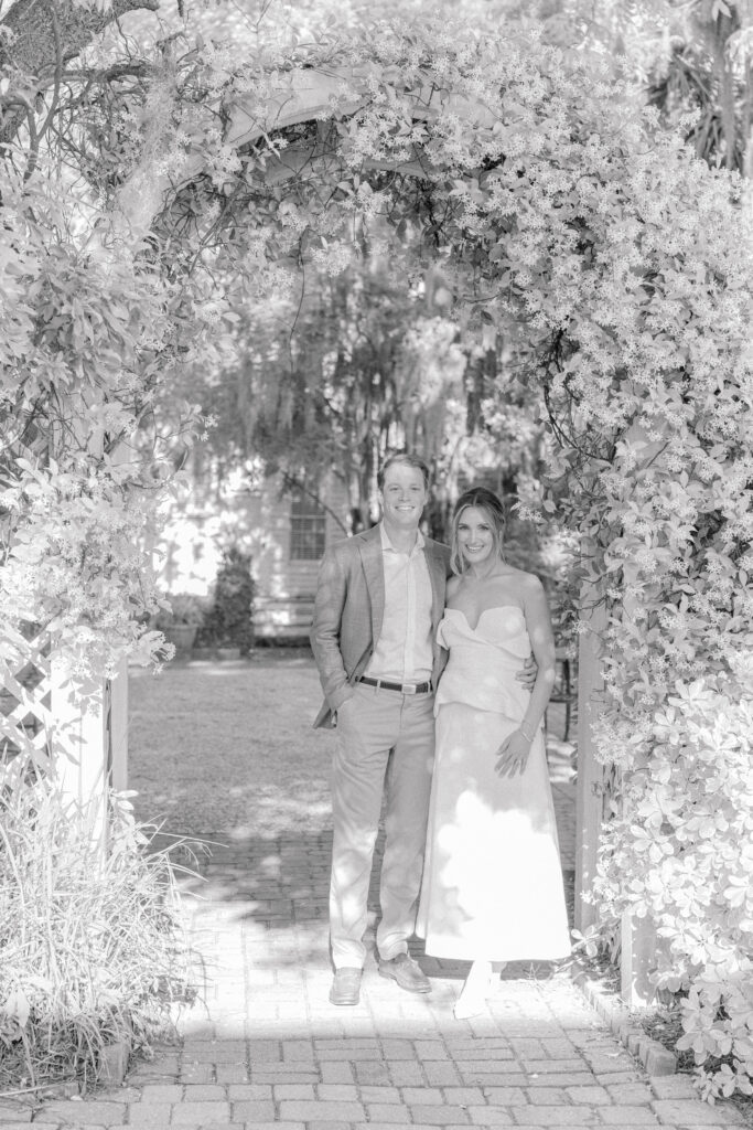 Pictures of the bride and groom under a blooming arch of jasmine at the Beaufort Inn. 