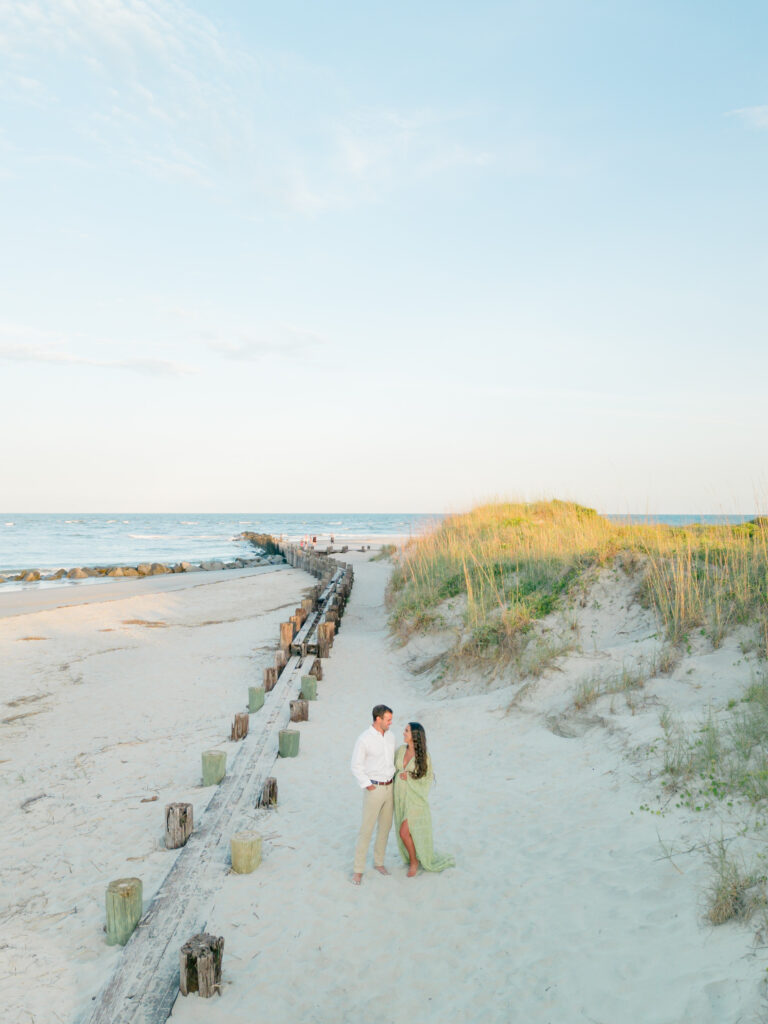 Maternity photos on Folly Beach during sunset at the Morris Island Lighthouse. 