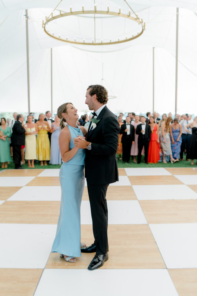 Groom dances with his sister during wedding reception. 