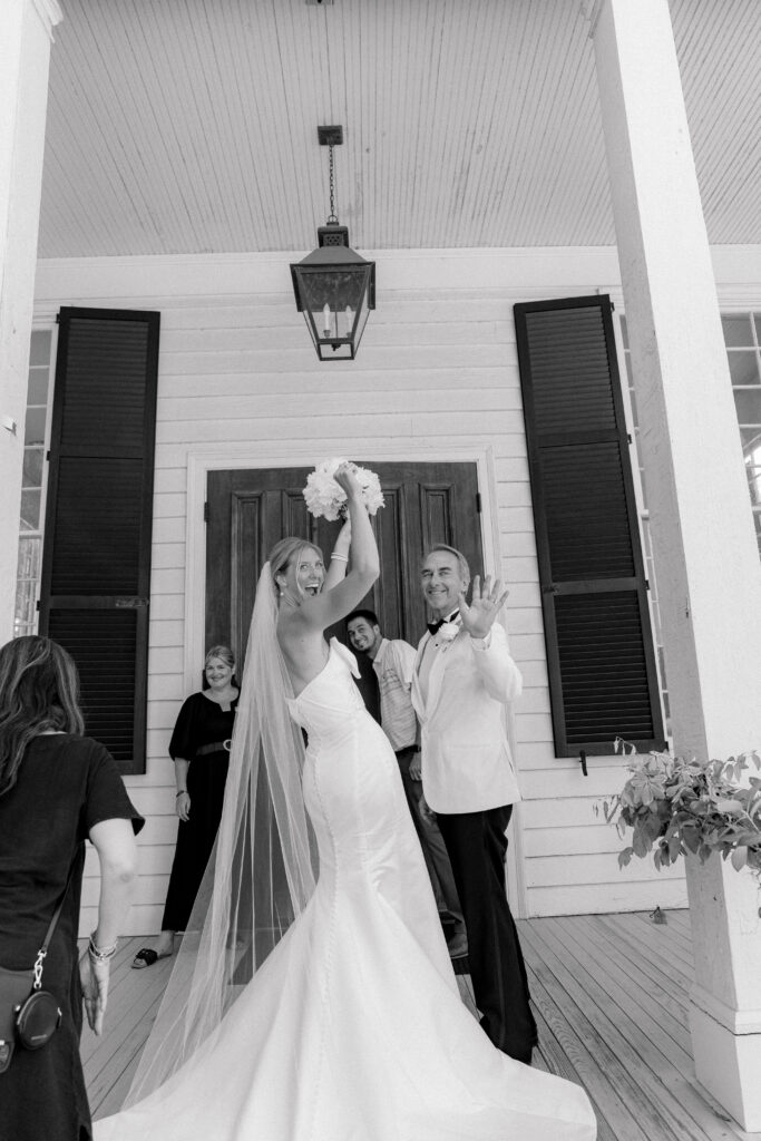 Bride and her dad celebrate before walking into wedding ceremony. 