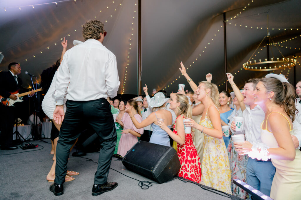 Bride and groom hop up on stage and get the crowd going. 