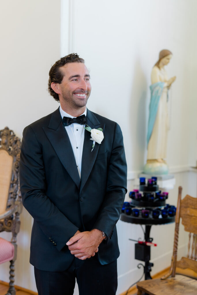 Groom sees bride for the first time on wedding day at wedding ceremony in downtown Beaufort. 