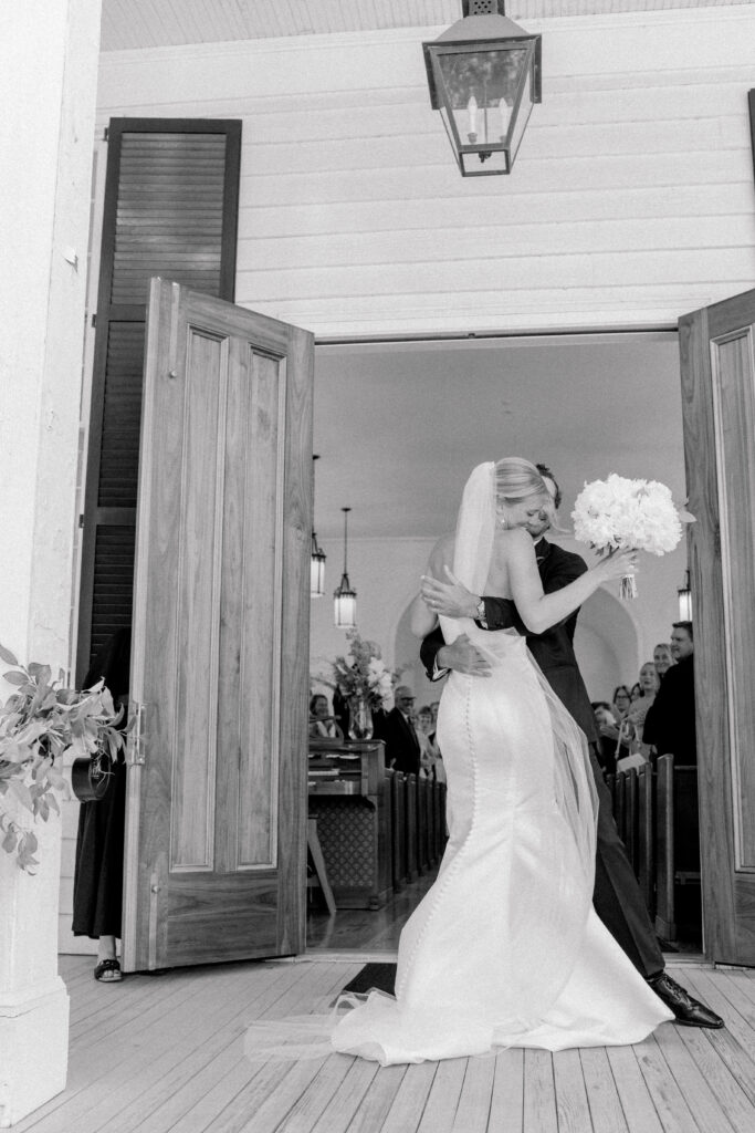 Intimate candid black and white moment of bride and groom. 