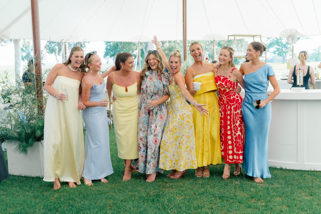 Colorful wedding guests dresses. Blue, yellow, and red. Floral patterns and solid colors. 