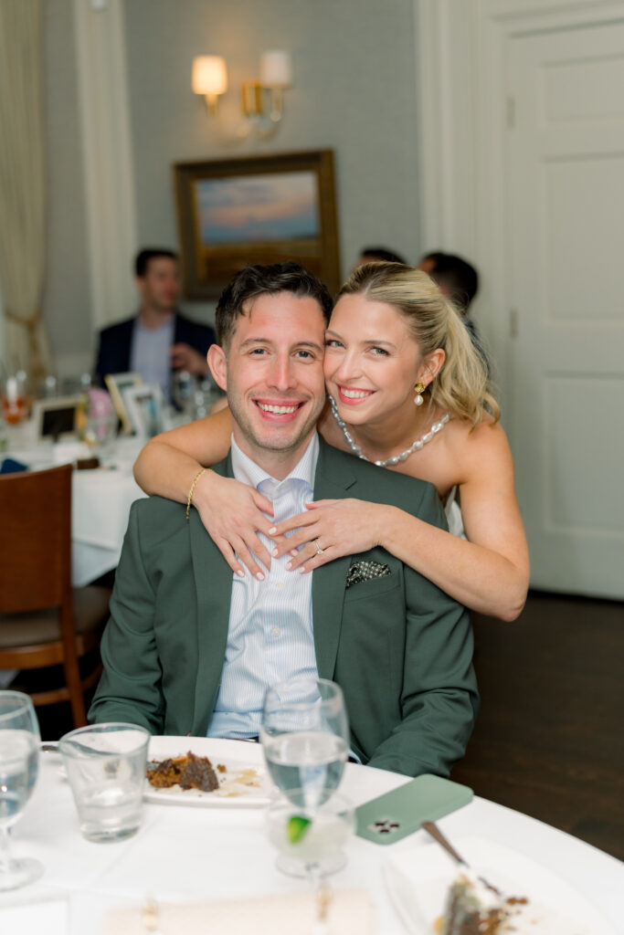 Charleston wedding rehearsal dinner. Bride and groom smiling for a picture. 