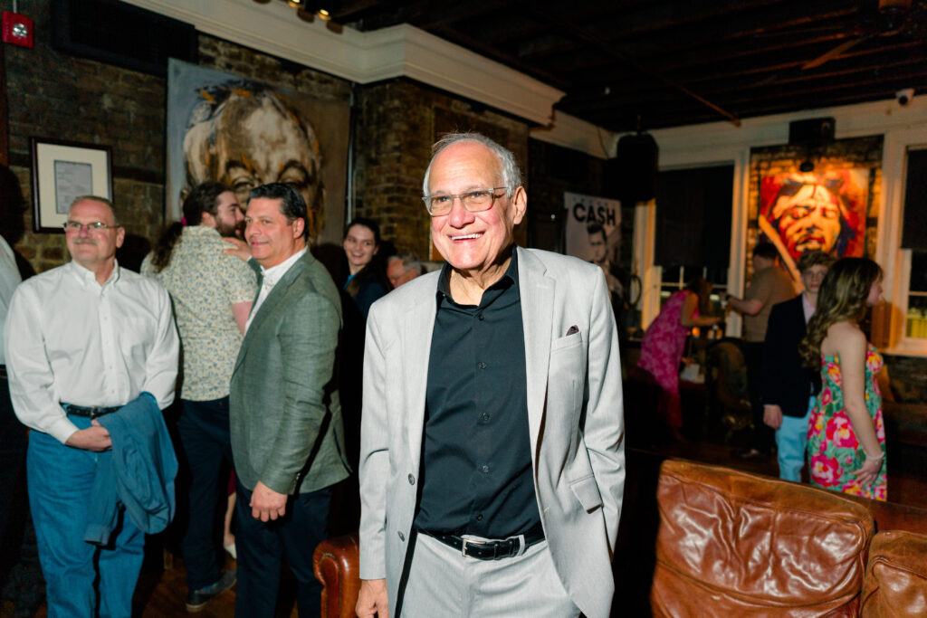 Father of the groom at wedding welcome party. 