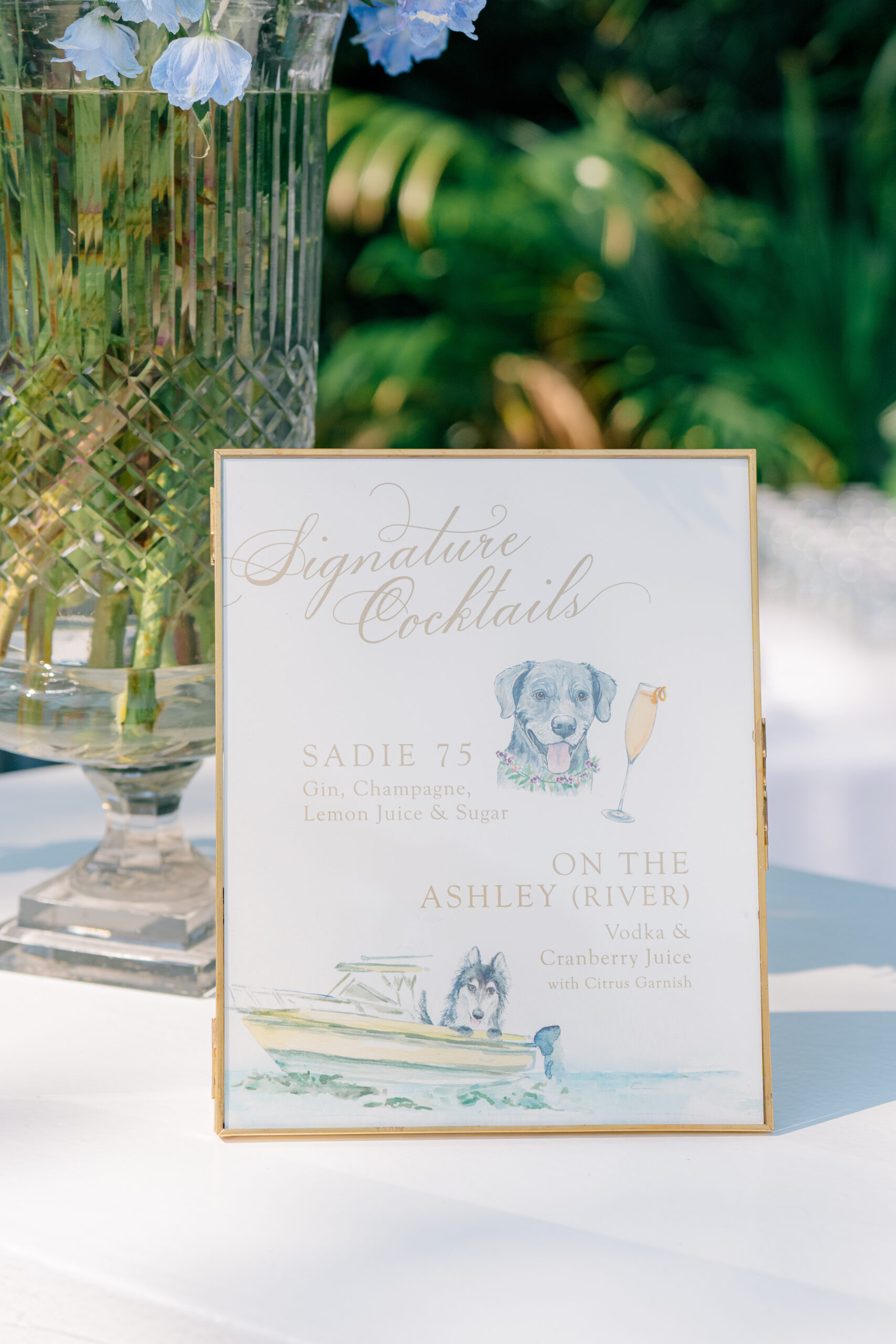 Signature cocktail sign featuring the bride and grooms pets. 