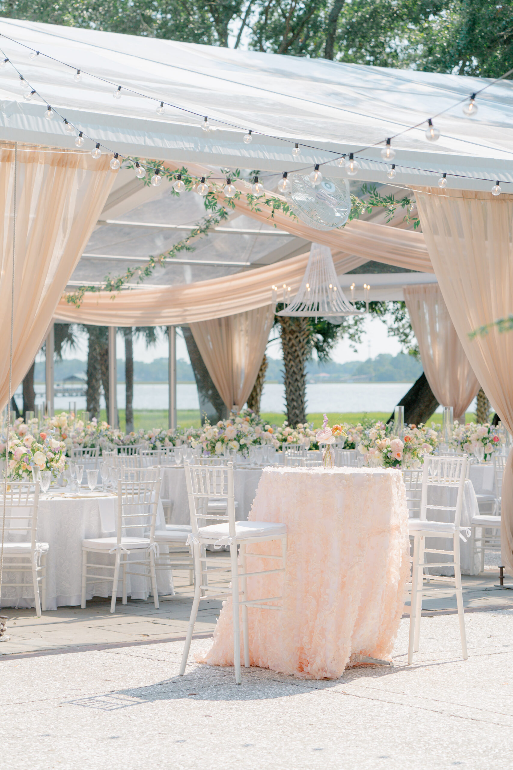 Cocktail table and outdoor plated dinner wedding reception. 