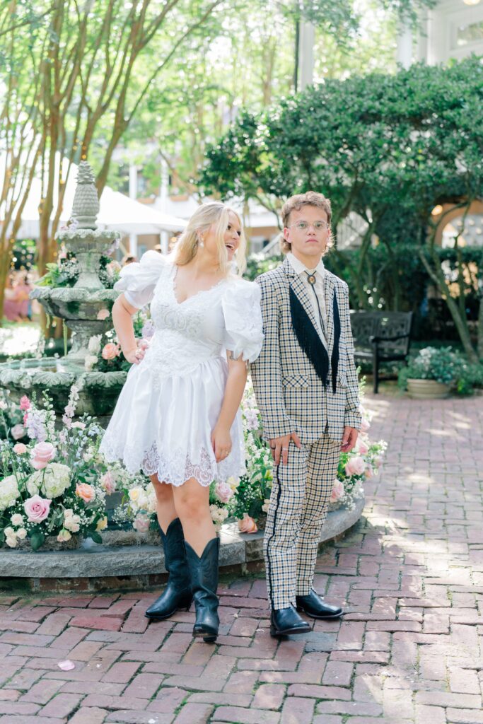 Bride and groom messing around with poses in front of the fountain at Thomas Bennett House. 