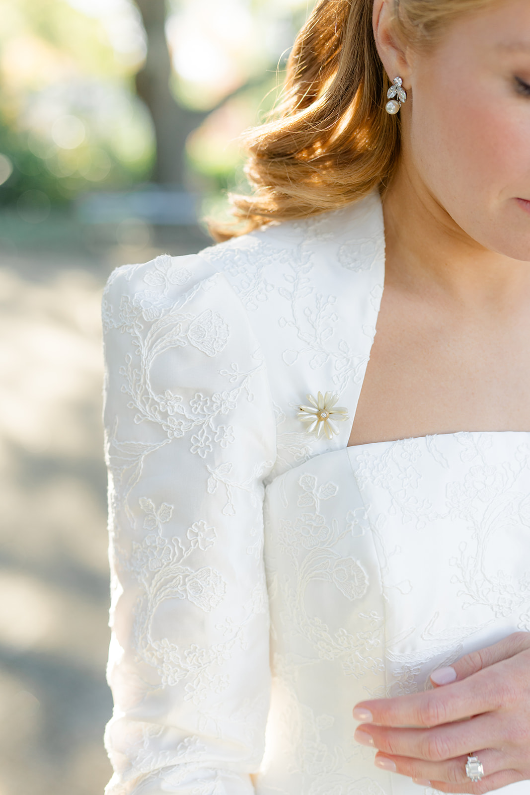 This wide wore a broach on her wedding dress from her mother. 
