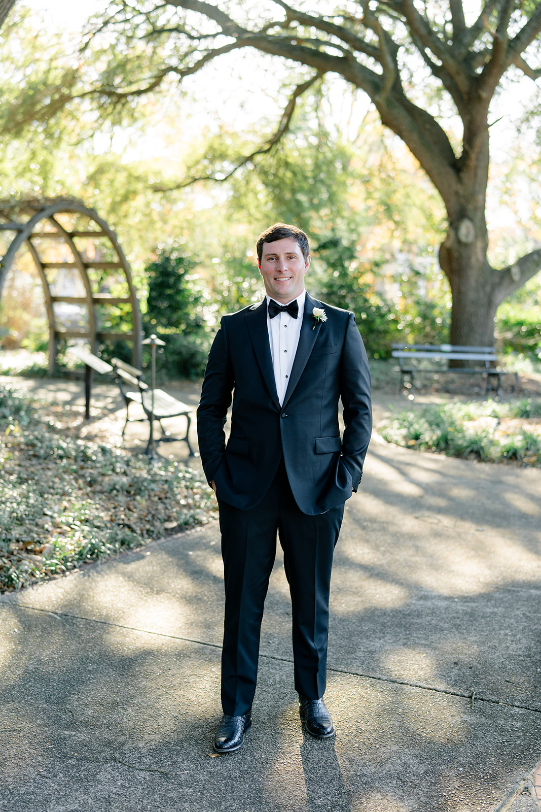 Groom in tuxedo and gator boots on his wedding day.