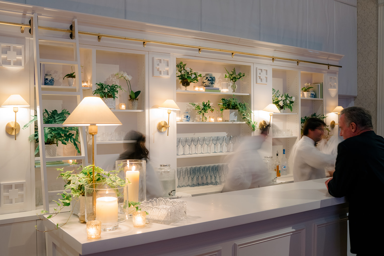 Bartenders working the bar. Wedding reception in downtown Charleston. 