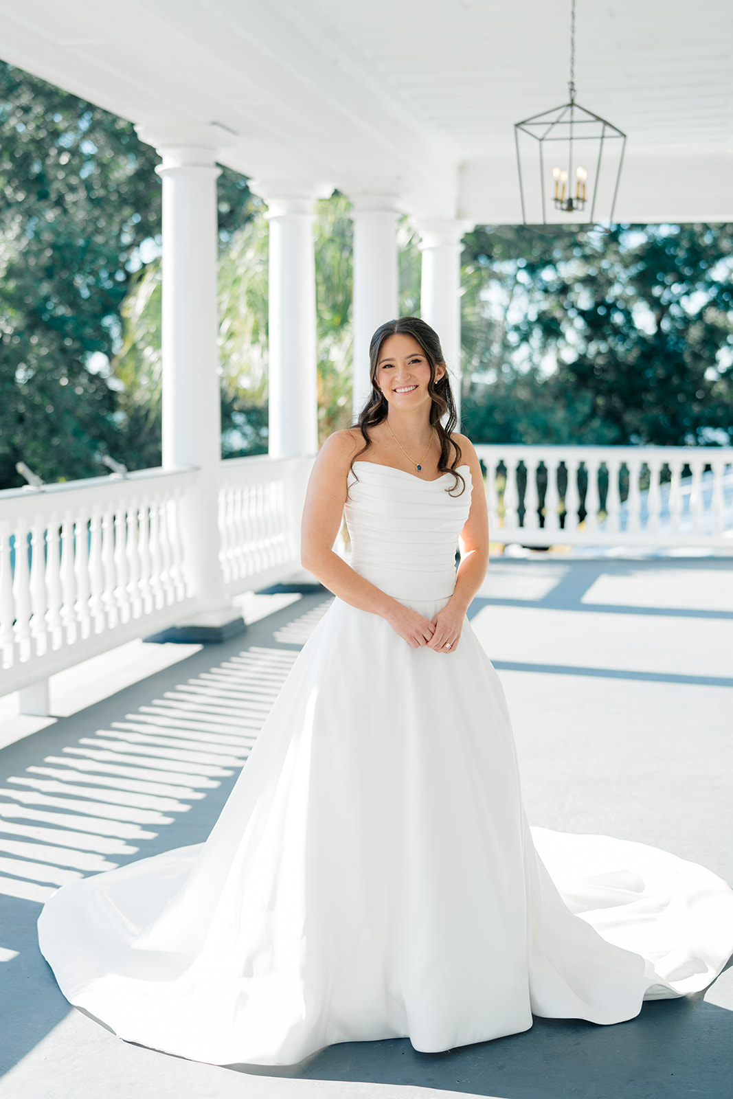 Wedding day bridal portrait on the top porch at Lowndes Grove. 