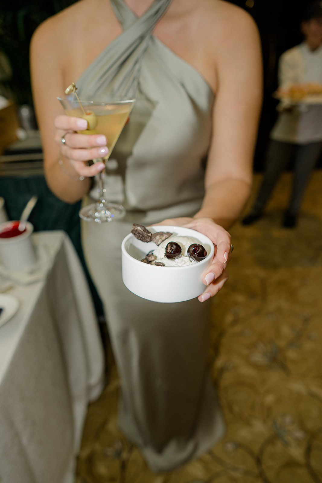 Dessert at Kiawah Island wedding. Bridesmaid holding drink and dessert. 