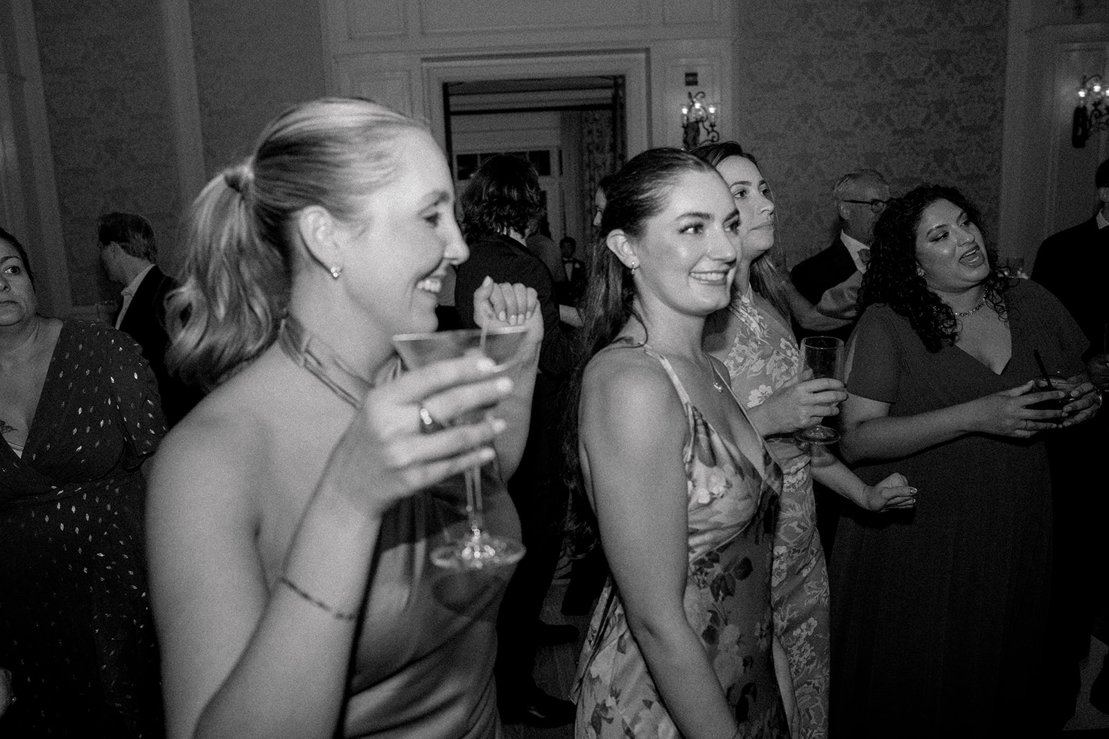 Candid of bridesmaids on dancefloor. 