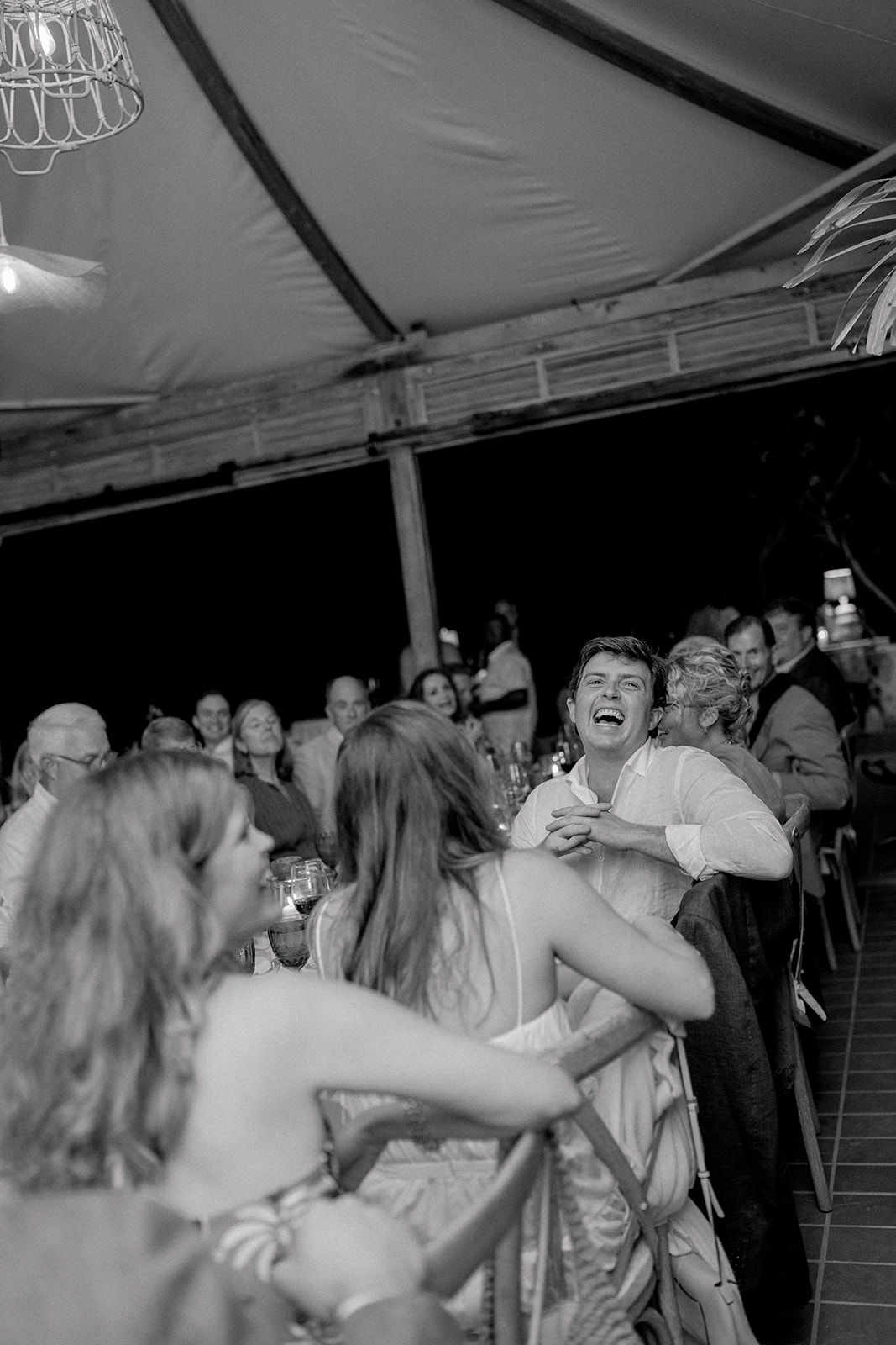 Groom laughs during speech. 