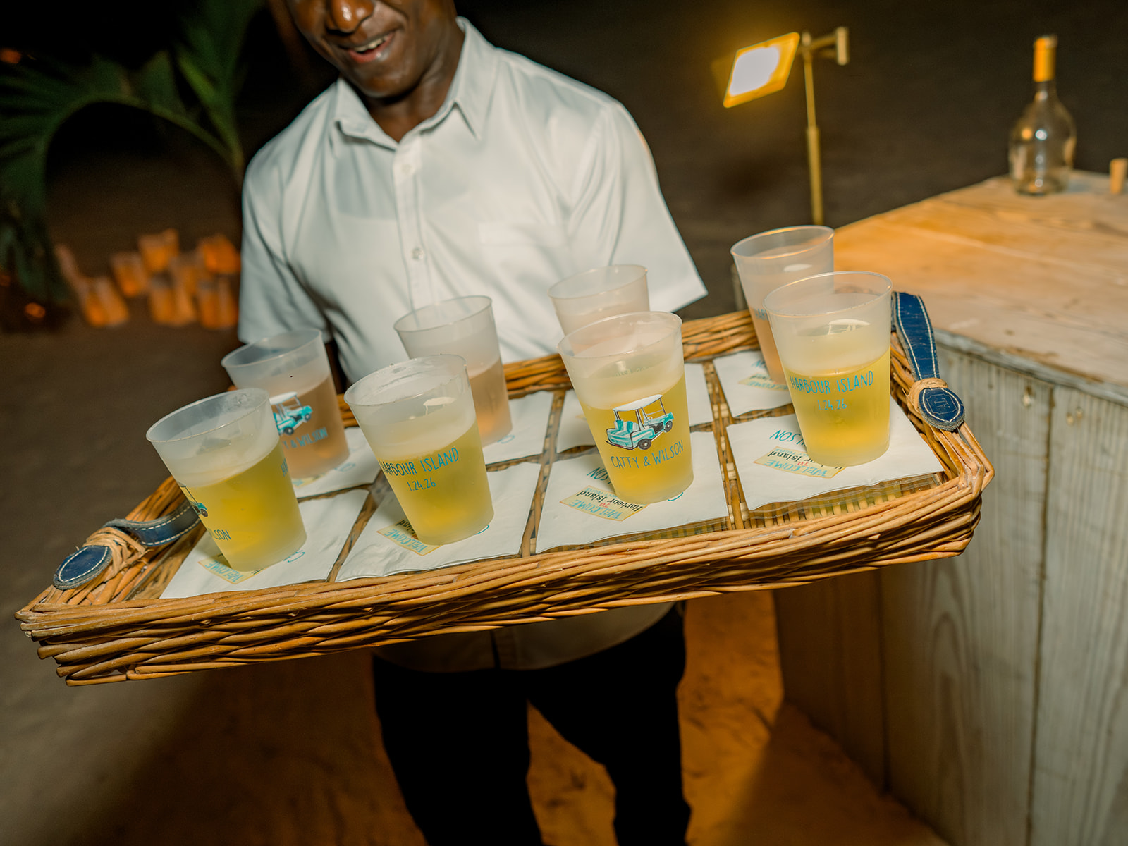 Wedding welcome party beers served in custom plastic cups with a golf cart on them. Harbour Island wedding. 