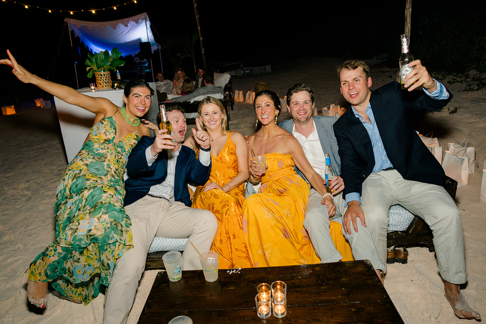 Candid moment of guests piling on the couch. 