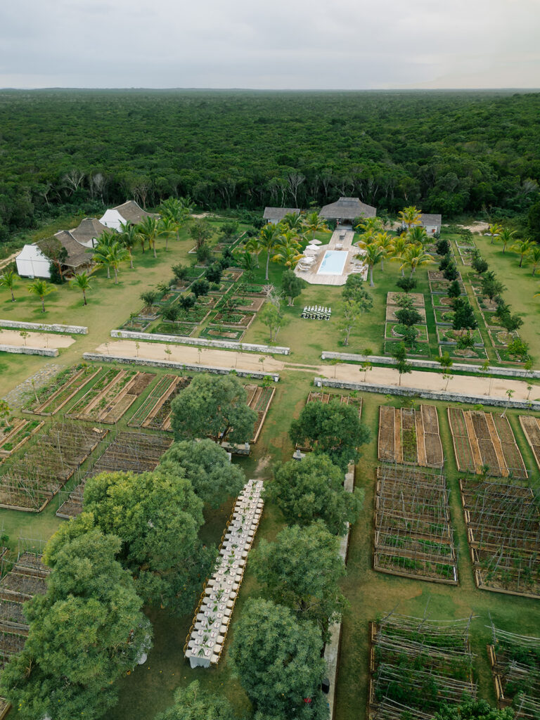 The Farm. Little Island Hotels drone shot with pool and long table. 