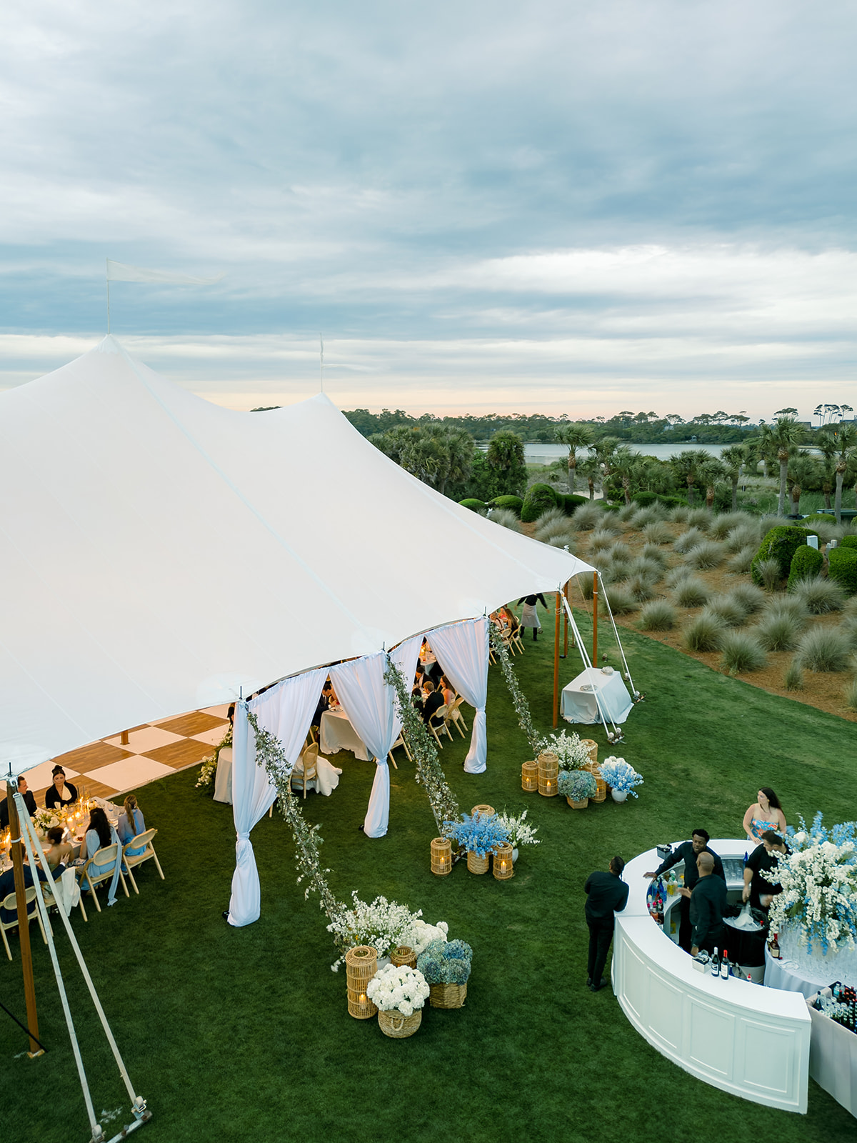 Blue and white wedding reception tent entrance. 