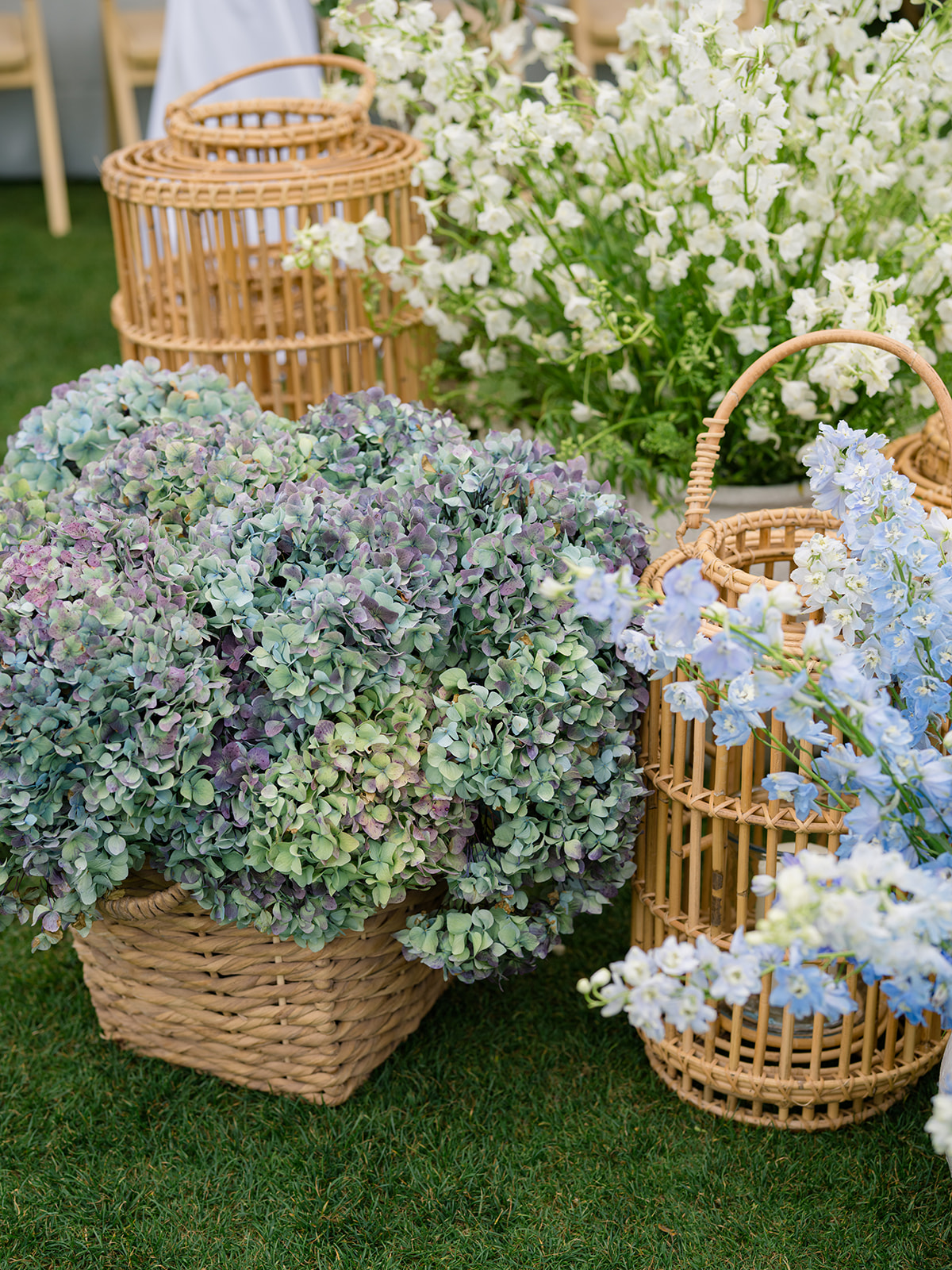 Blue and white reception entrance flowers in baskets. 