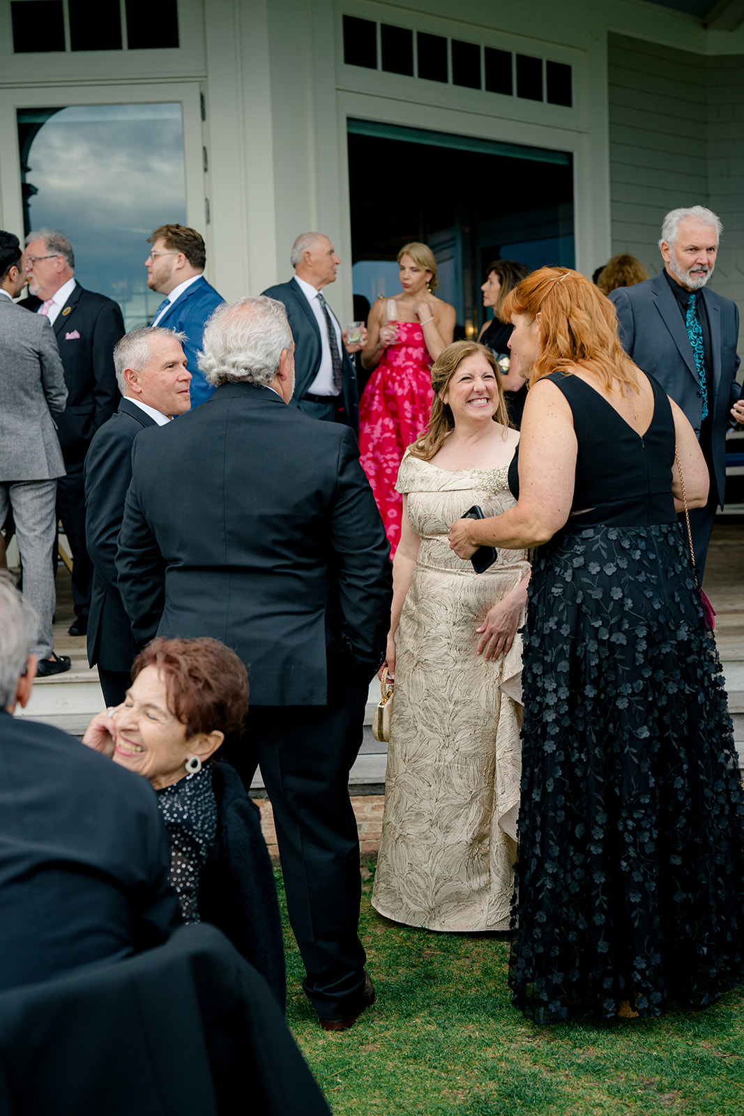 Parents of the groom with guests at cocktail hour.