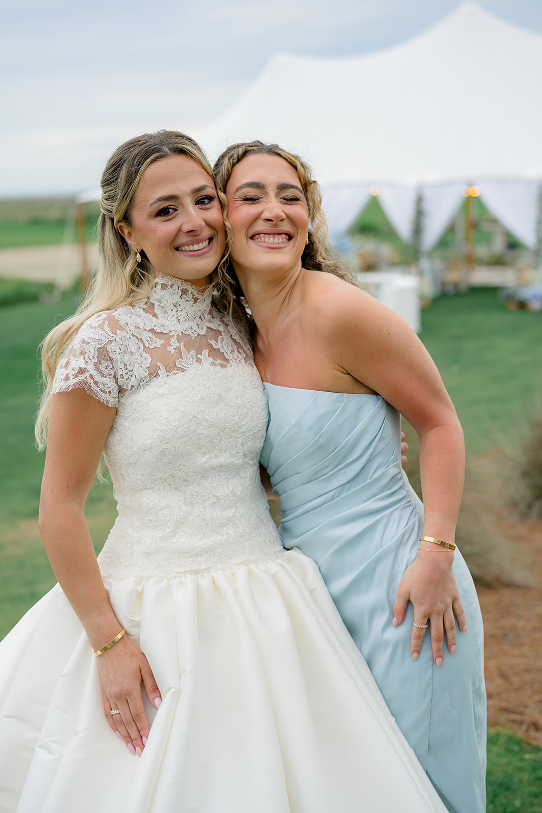 Bride with her sister at cocktail hour.