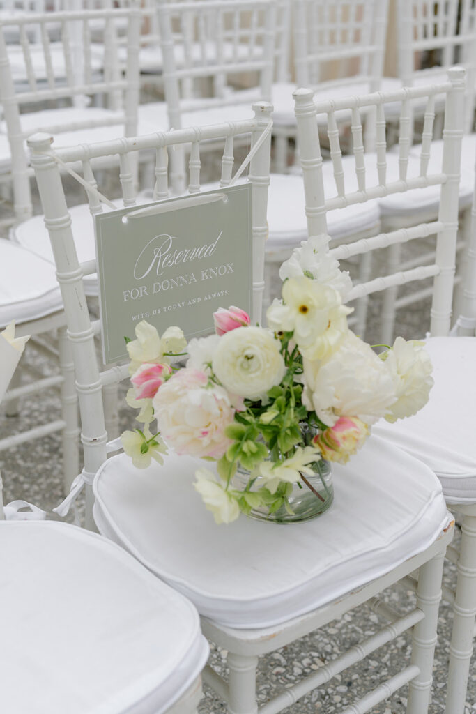 Bride reserves a seat for her late mother at wedding ceremony. 