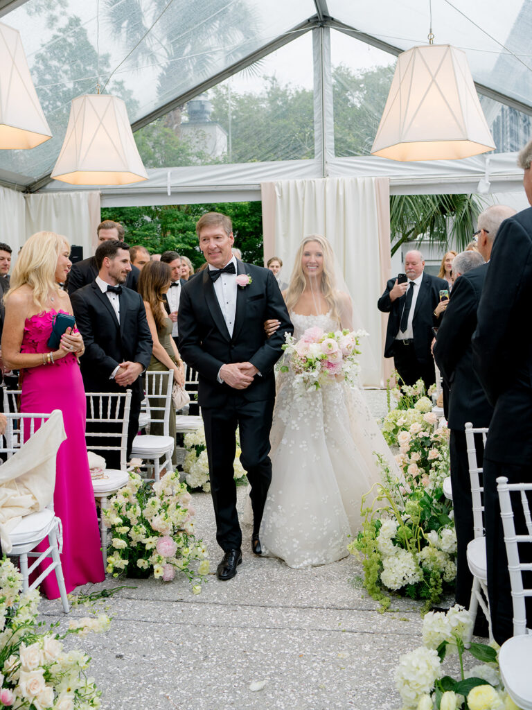 Bride escorted by her dad for tented Lowndes Grove wedding. 