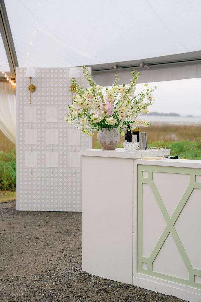 Waterfront cocktail hour. White bar with light green accepts. 