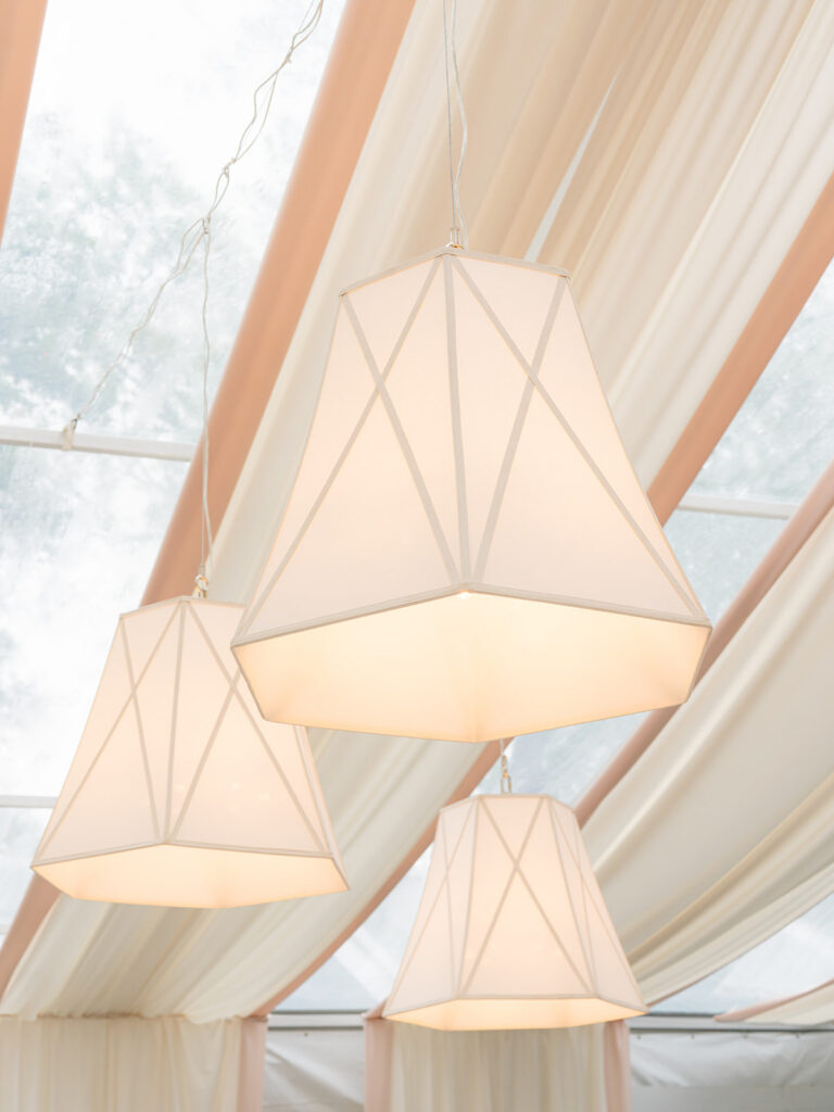 Hanging lamp shade lights with pink and white draping. Lowndes Grove wedding. 