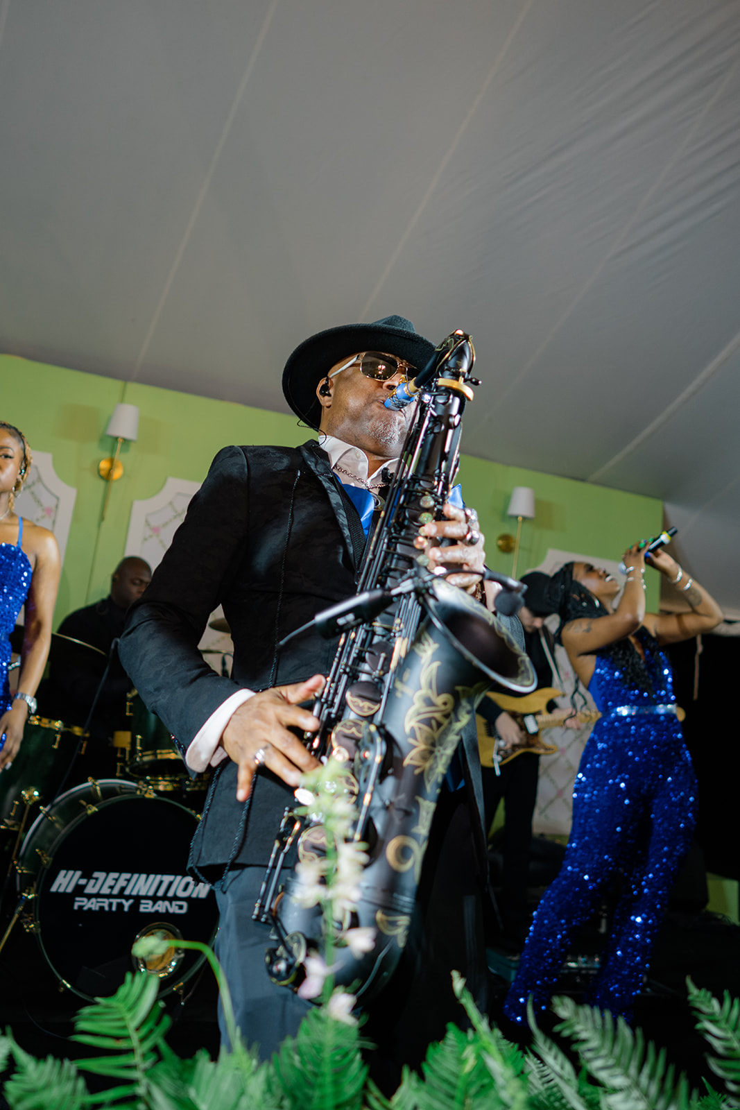 Live band performance saxophone player. 