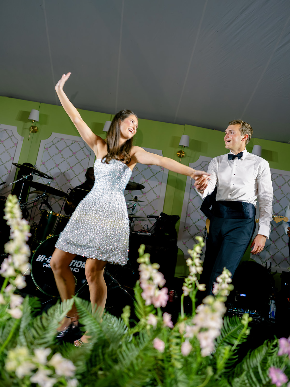 Bride and groom on the stage during wedding reception. 