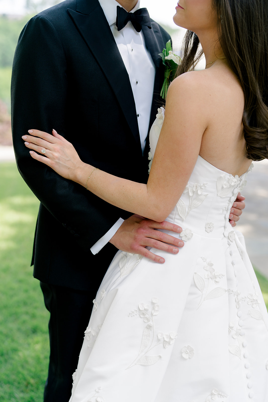 Bride and groom holding each other. 