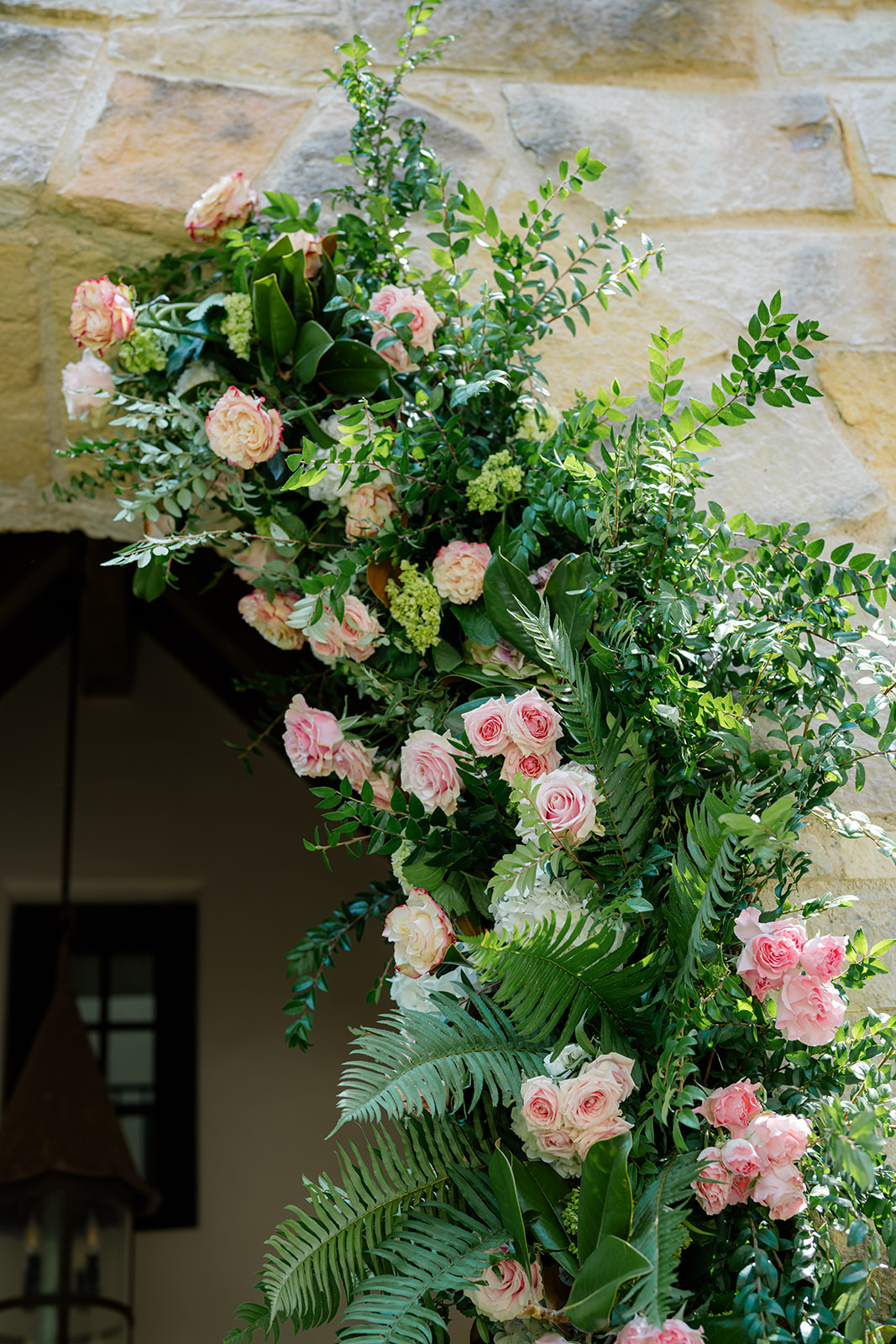 Pink and green flower arch detail.