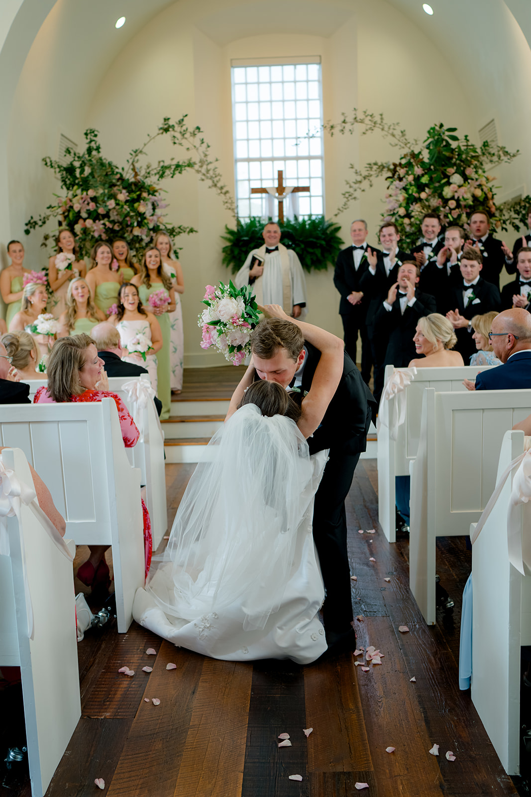 Wedding ceremony exit dip kiss.