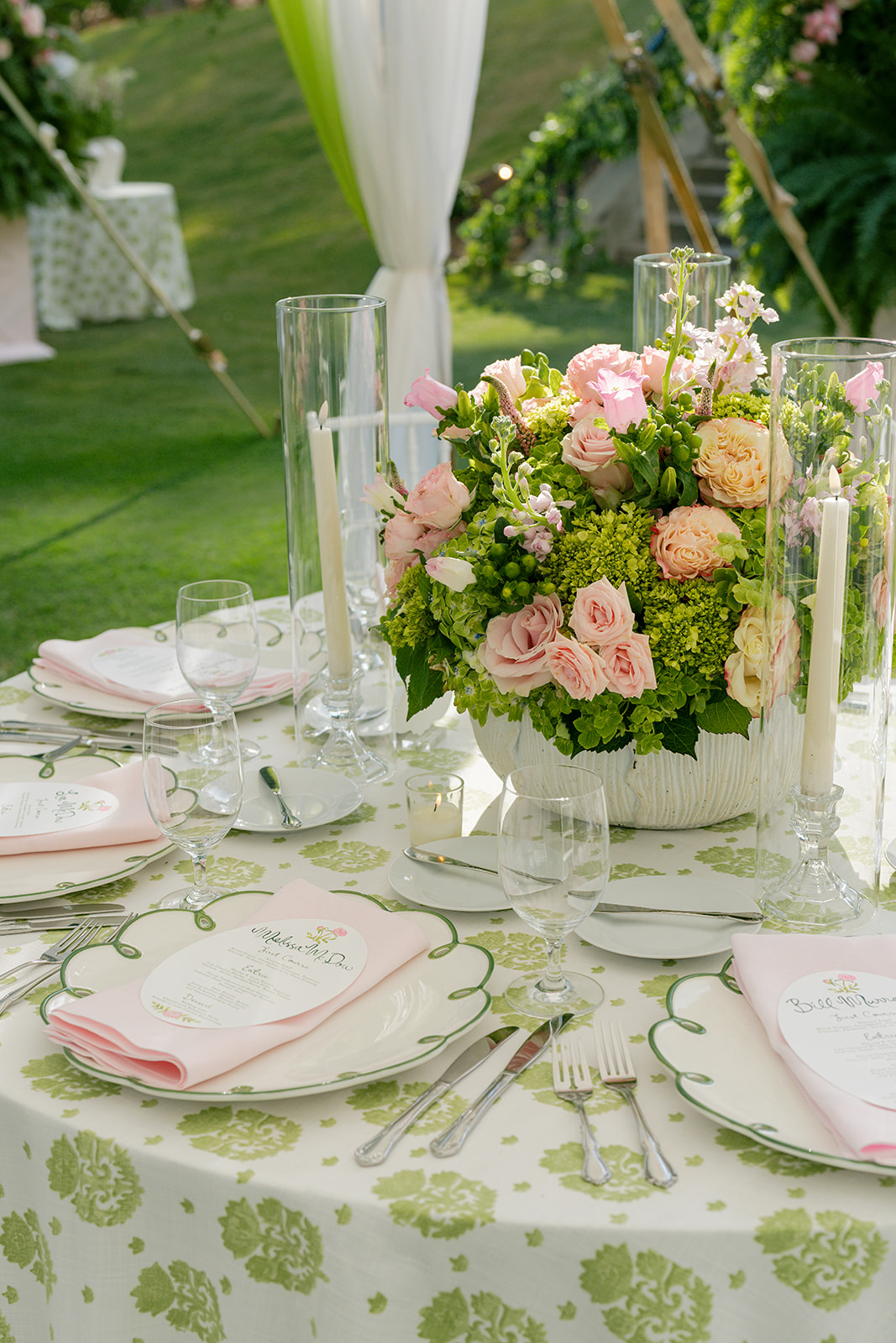 Circular table top with pink and green details.