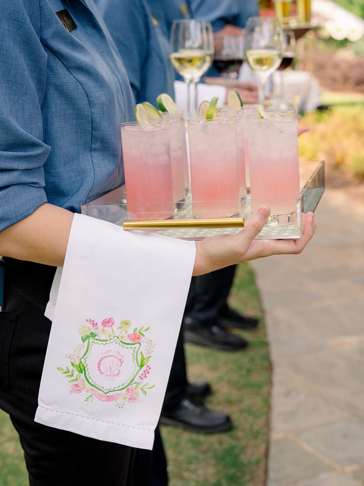 Pink lemonade cocktails on a tray with custom servers napkin. Cocktail hour welcome drinks. 