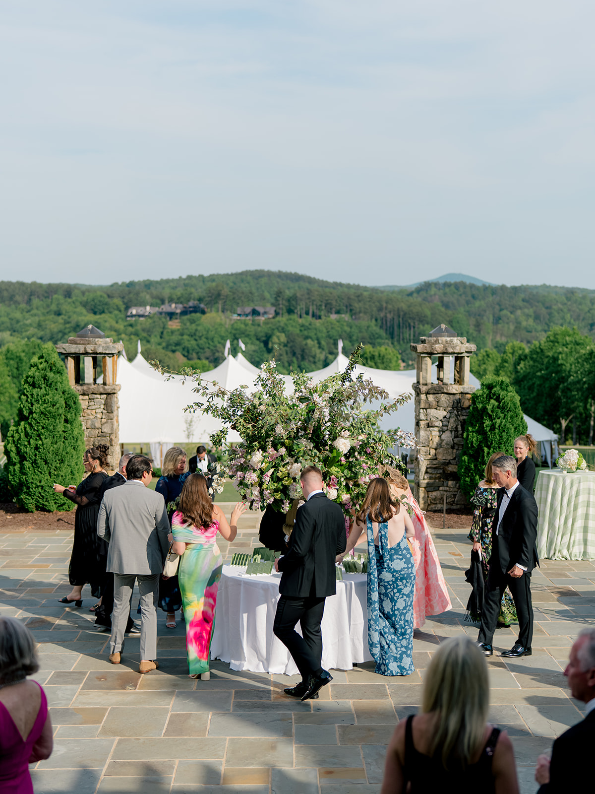 Wedding guest find their seat on seating chart.