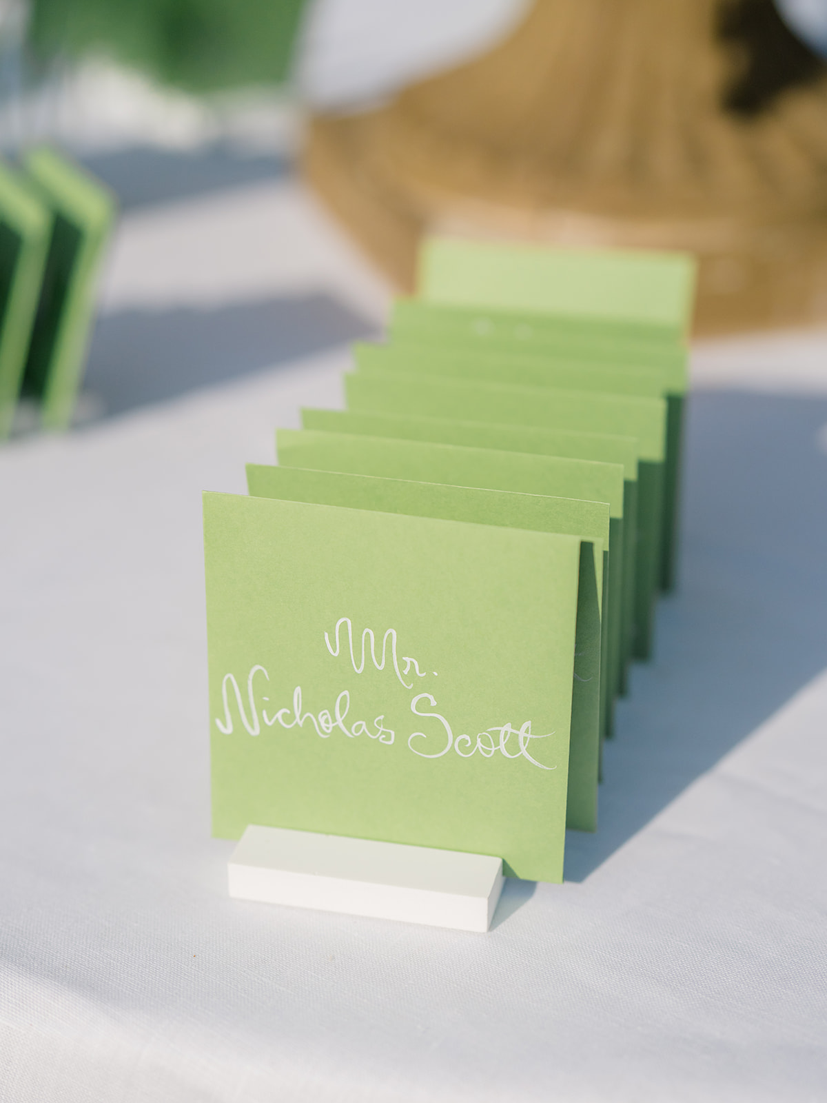 Green envelopes with white handwriting. Bride and groom wrote custom notes to each of their wedding guests. 